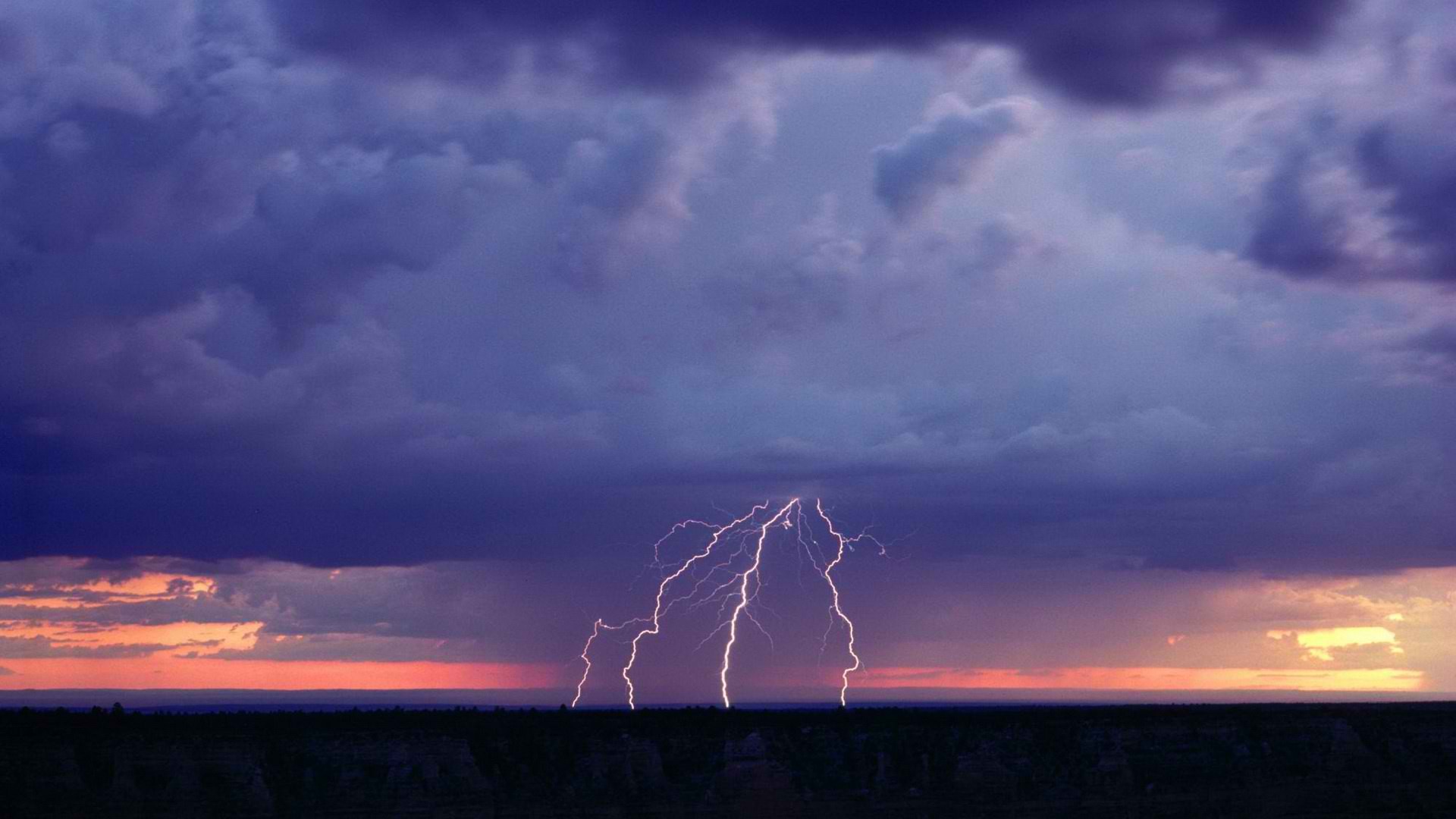 Lightning strike over desert landscape