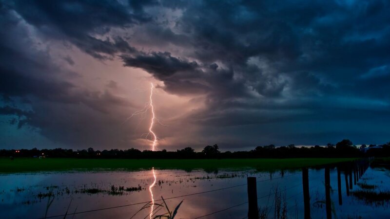 Lightning strike over flooded field