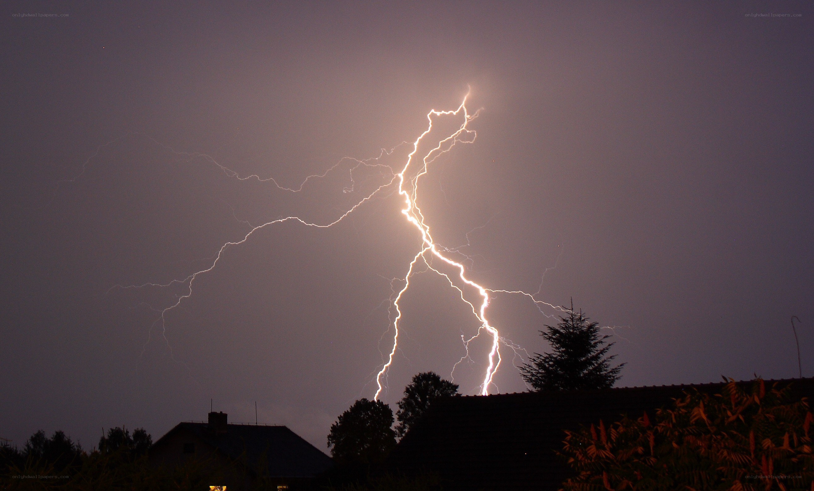 Lightning strike over houses