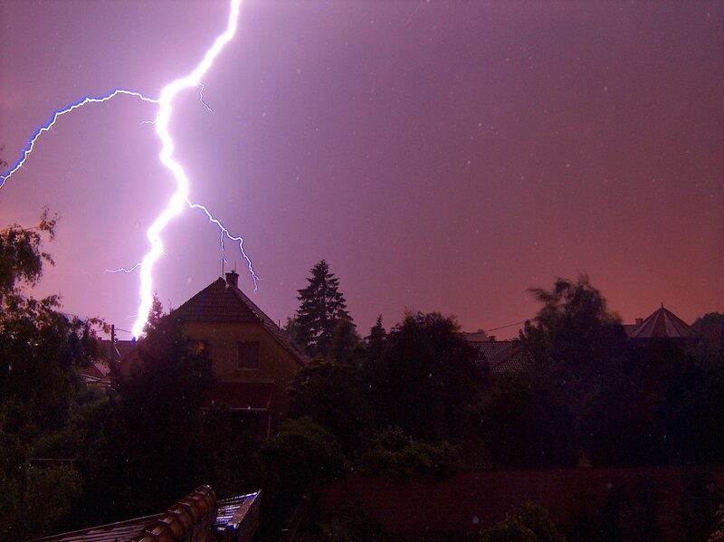 Lightning strike over houses
