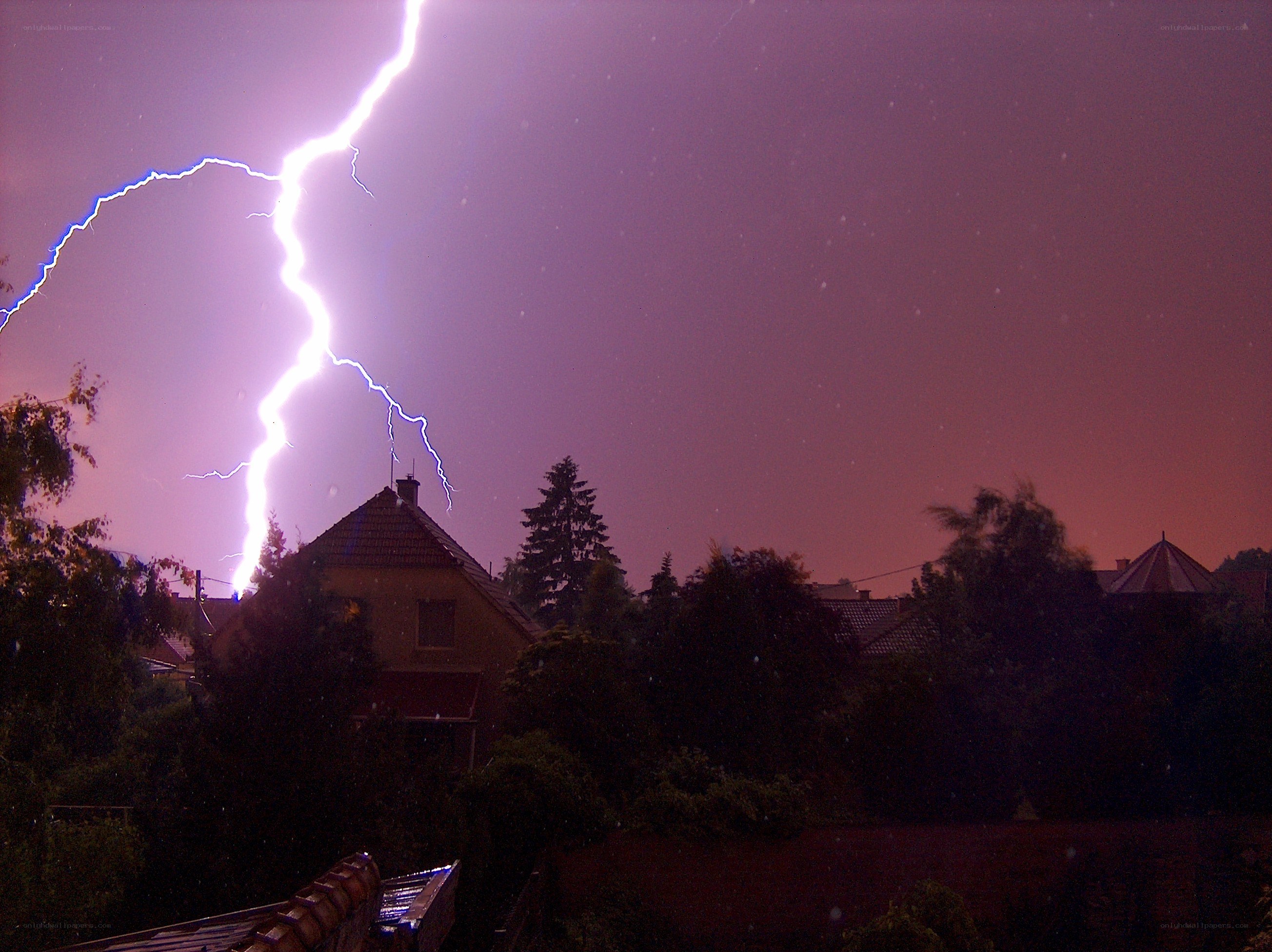 Lightning strike over houses