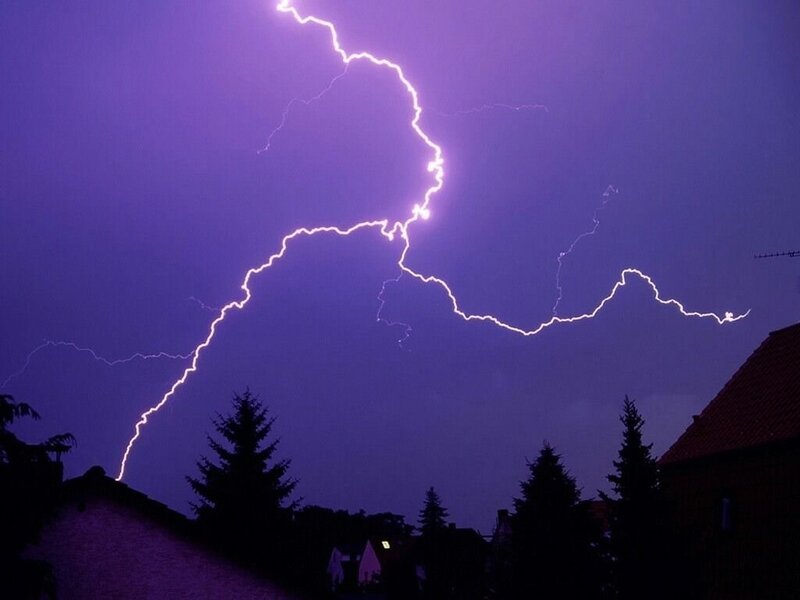 Lightning strike over houses
