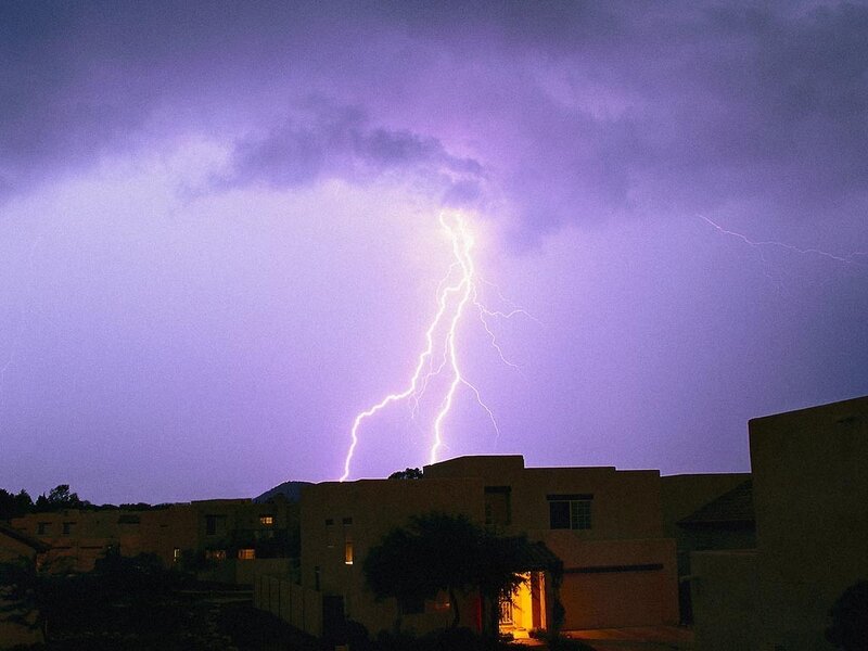 Lightning strike over houses