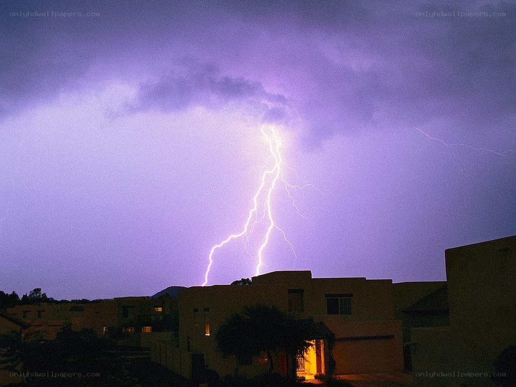 Lightning strike over houses