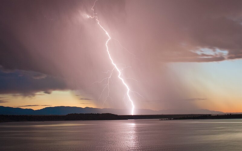 Lightning strike over lake