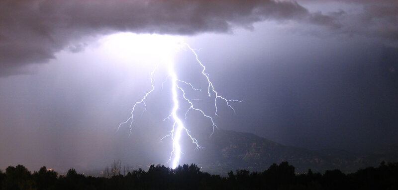 Lightning strike over mountain
