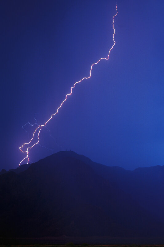 Lightning strike over mountain