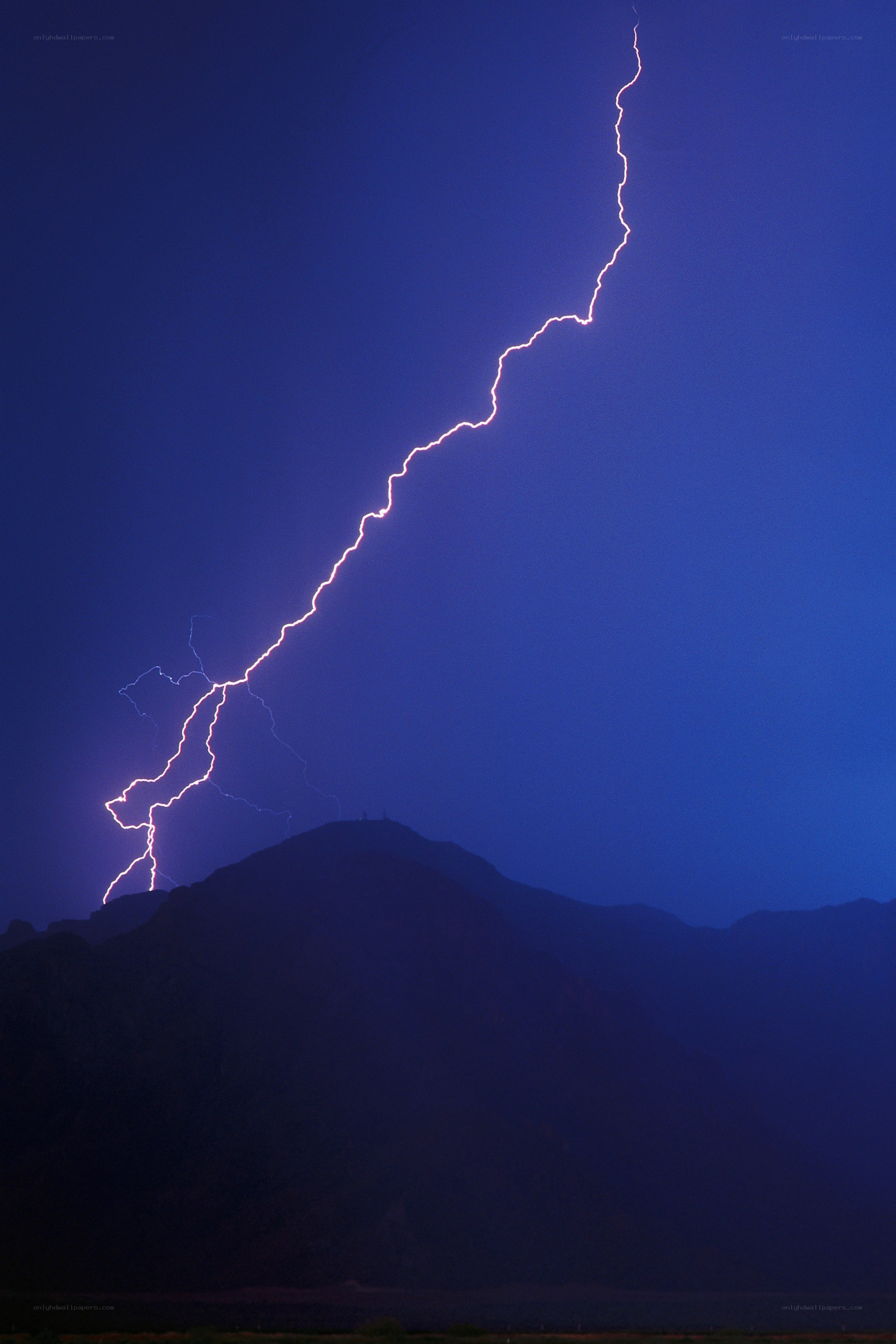 Lightning strike over mountain