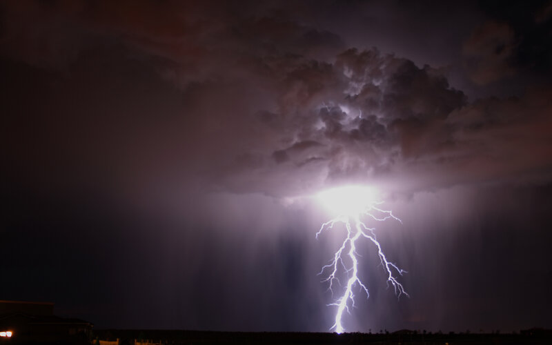 Lightning strike over storm clouds