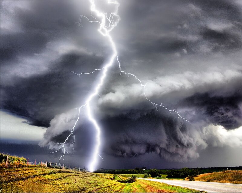 Lightning strike over stormy landscape