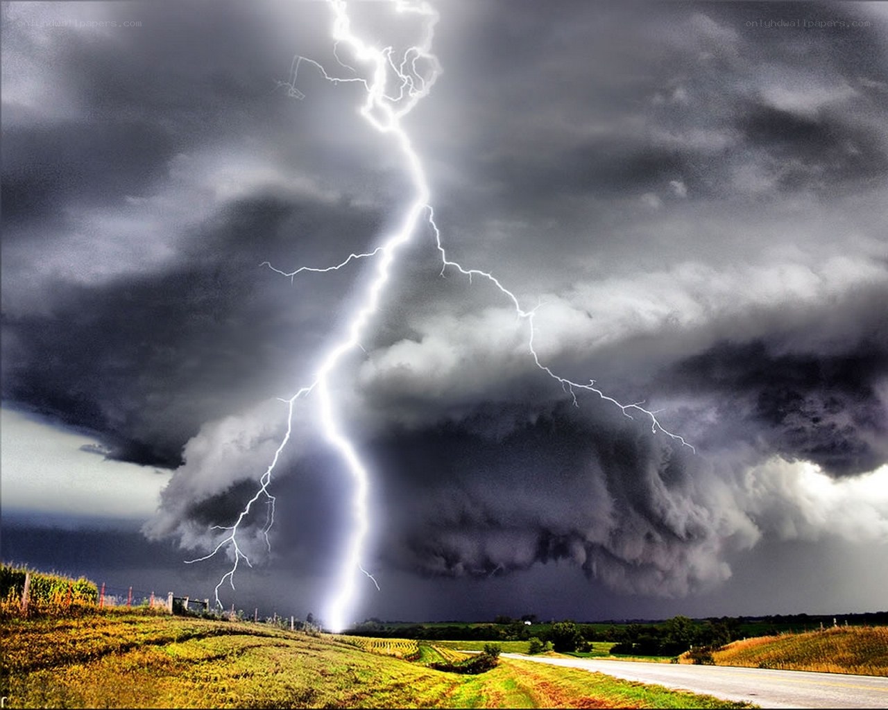 Lightning strike over stormy landscape