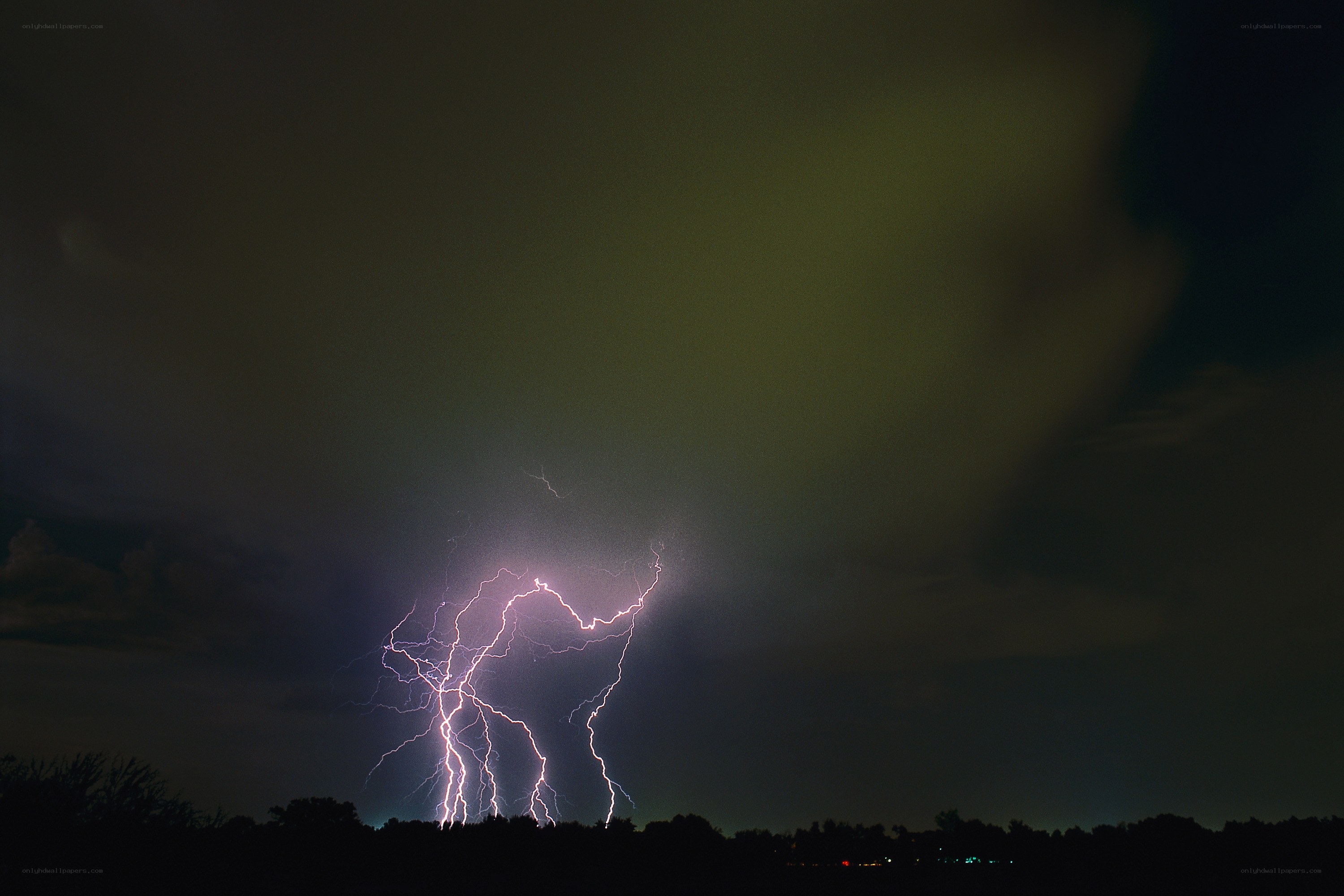 Lightning strike over trees