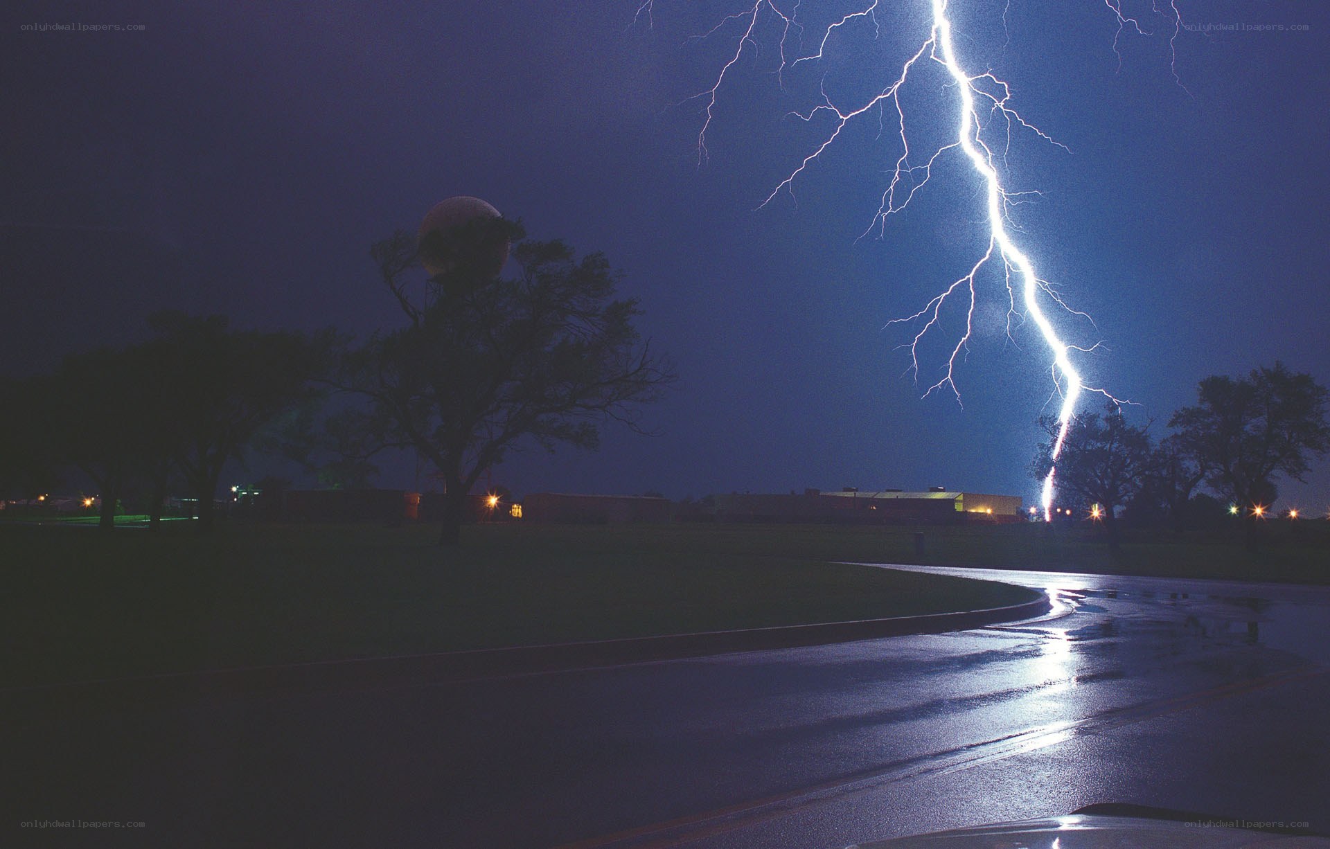 Lightning strike over wet road
