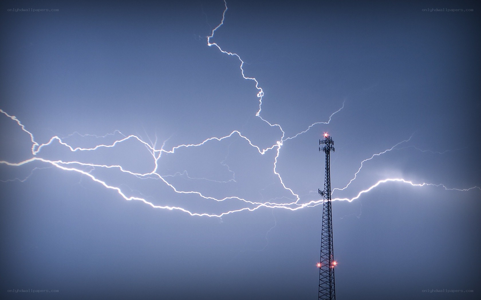 Lightning strikes near a tower