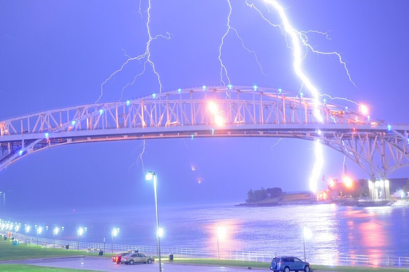 Lightning strikes over a bridge