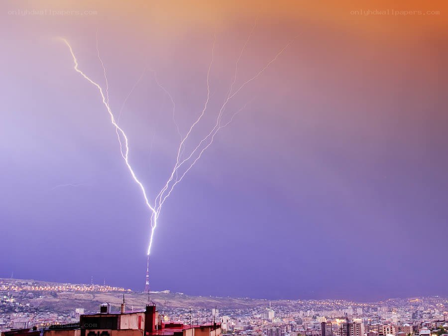 Lightning strikes over city