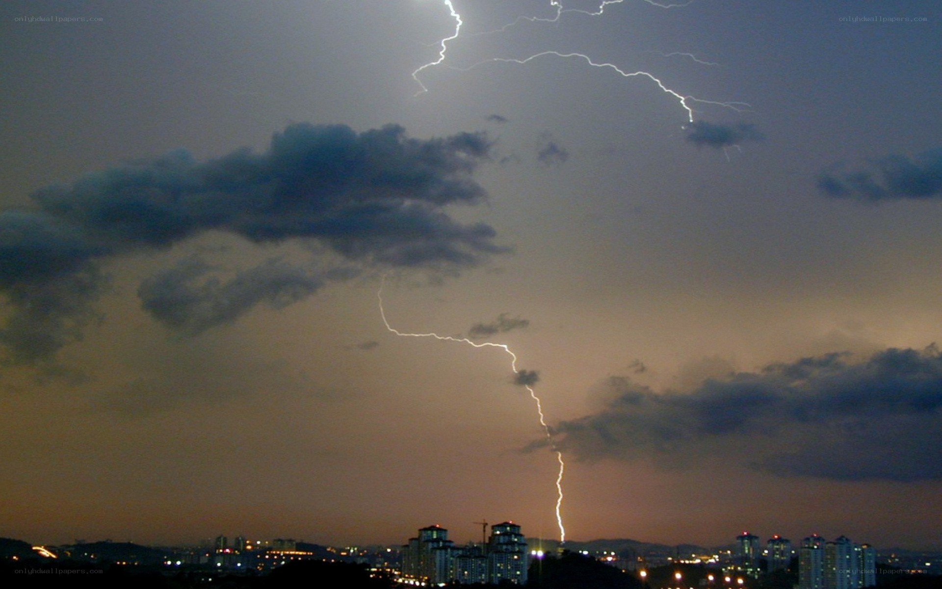 Lightning strikes over city