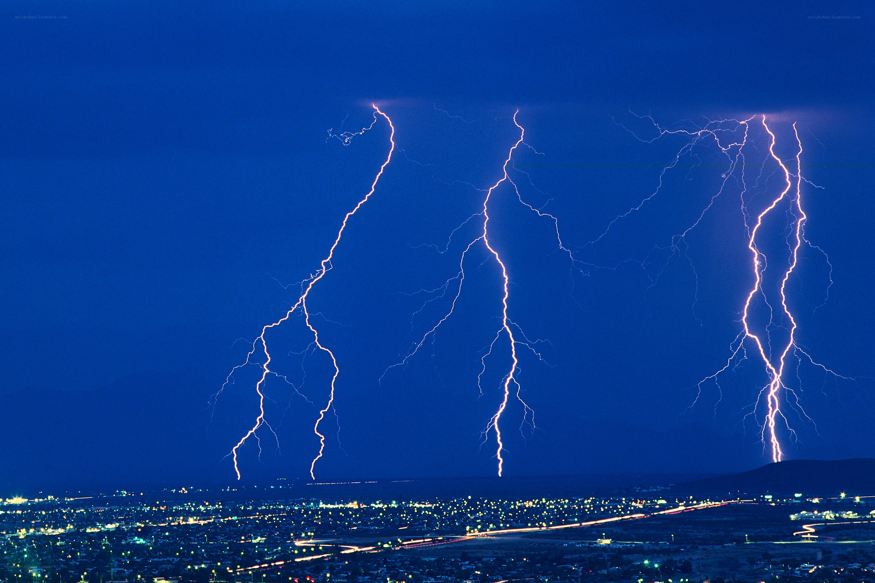 Lightning strikes over city