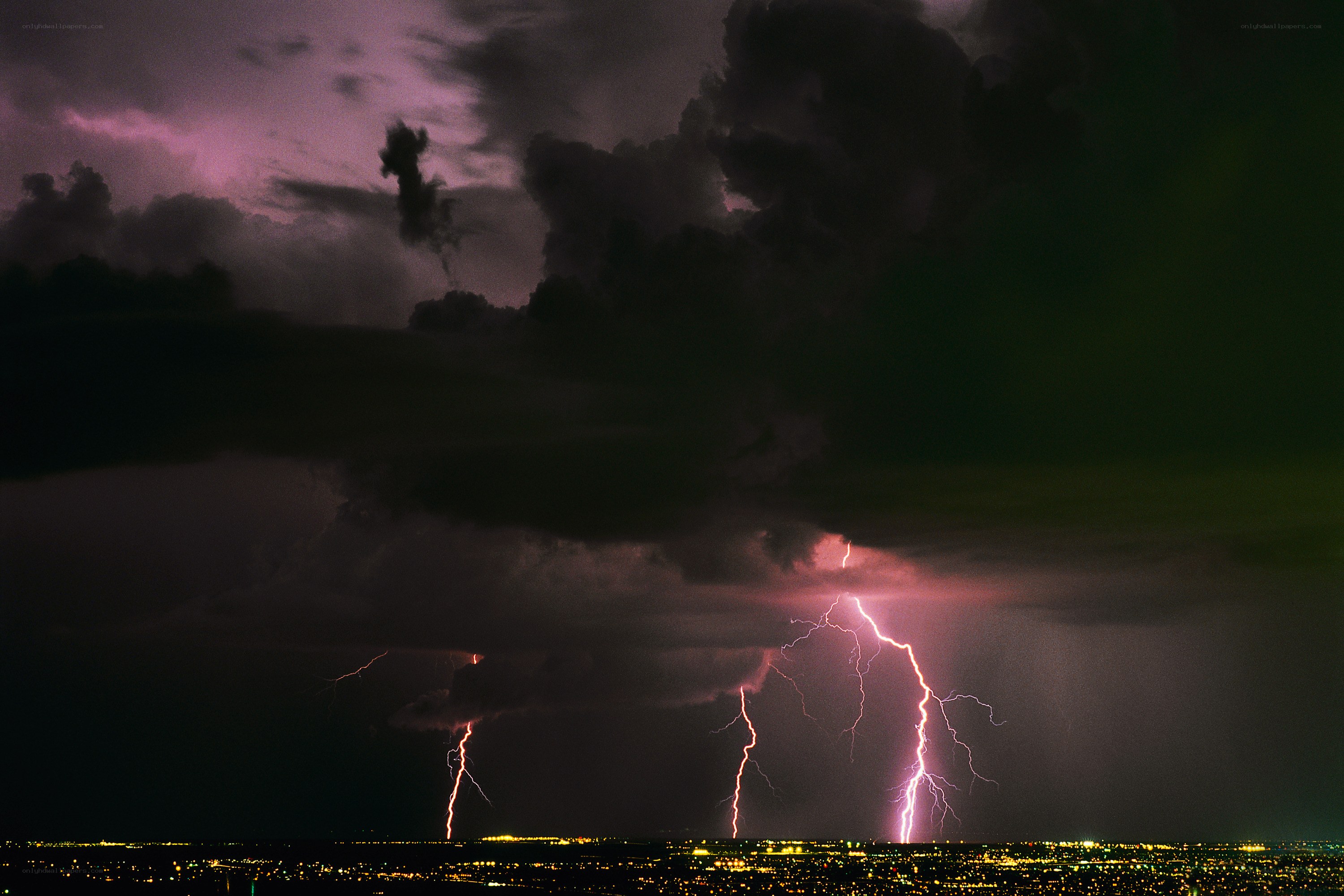 Lightning strikes over city
