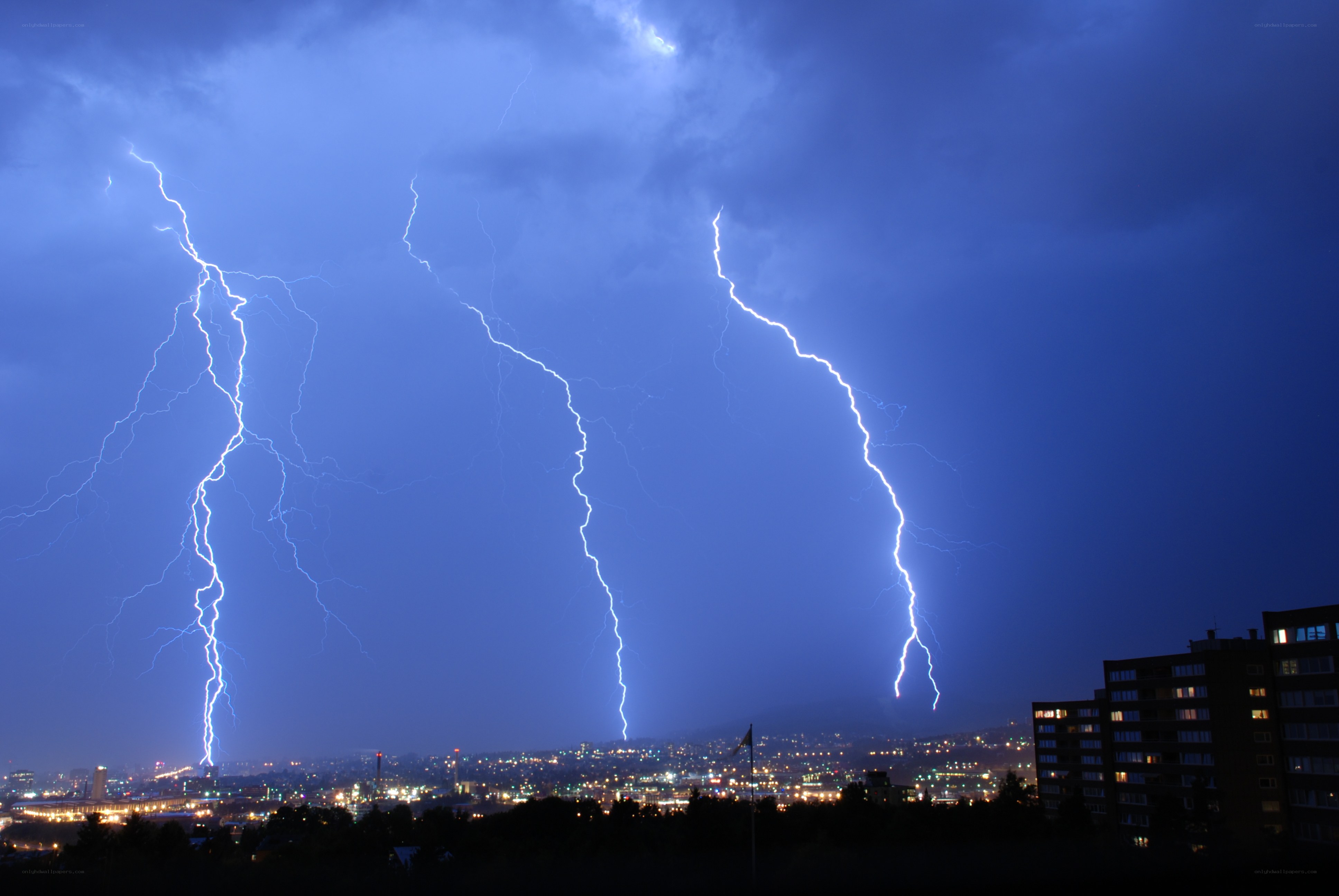 Lightning strikes over city