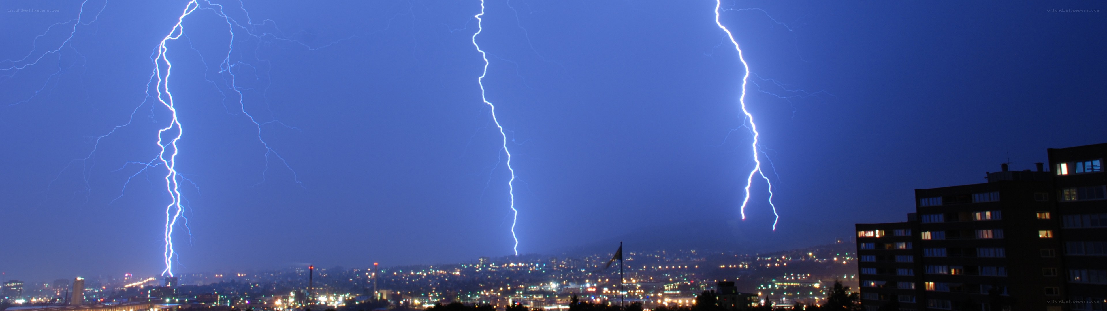 Lightning strikes over city