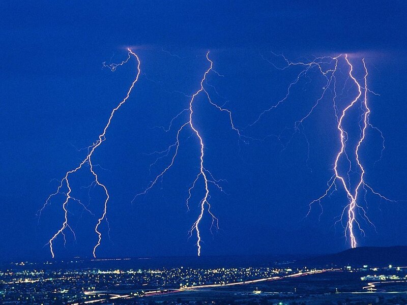 Lightning strikes over city