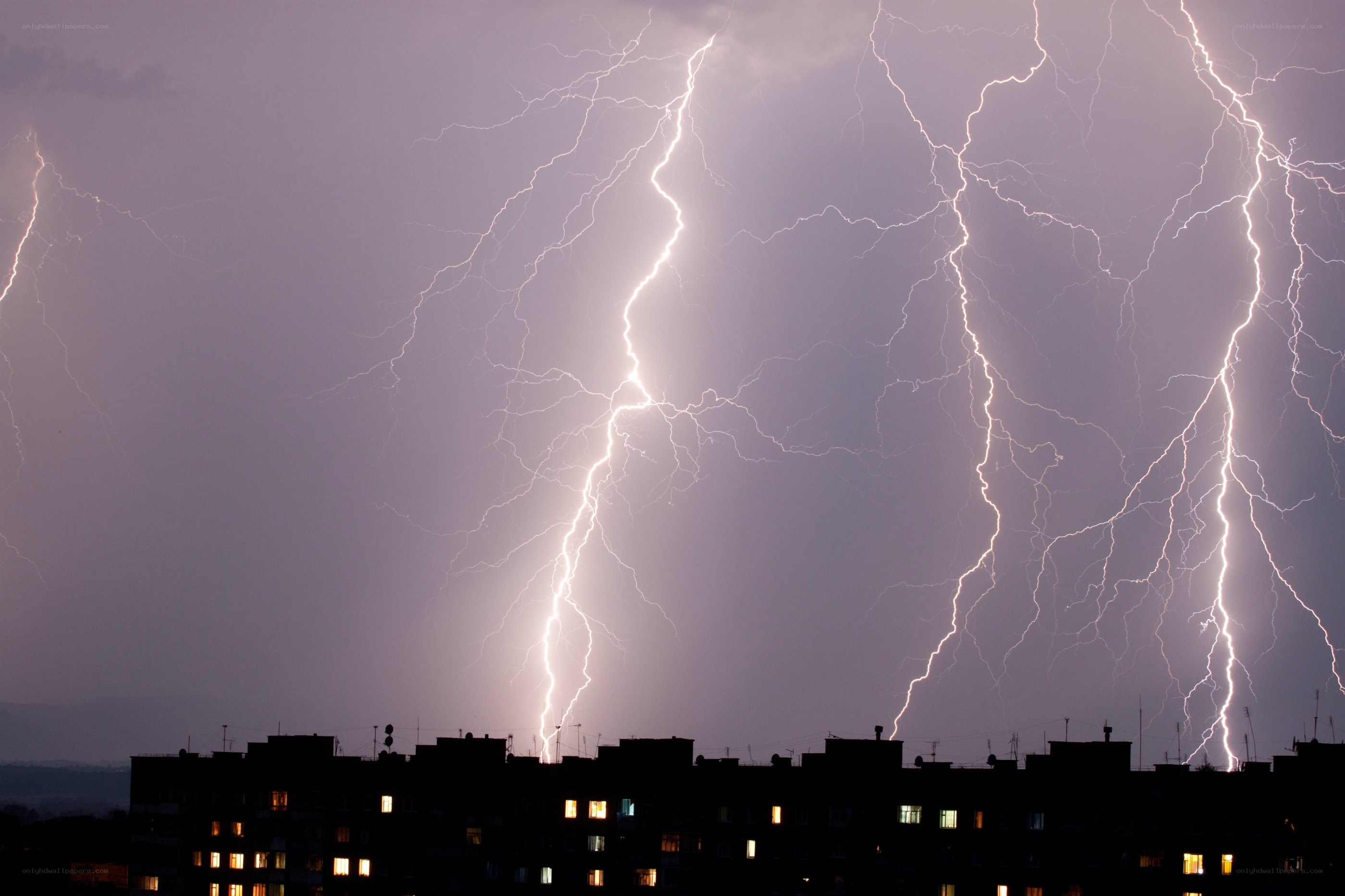 Lightning strikes over city