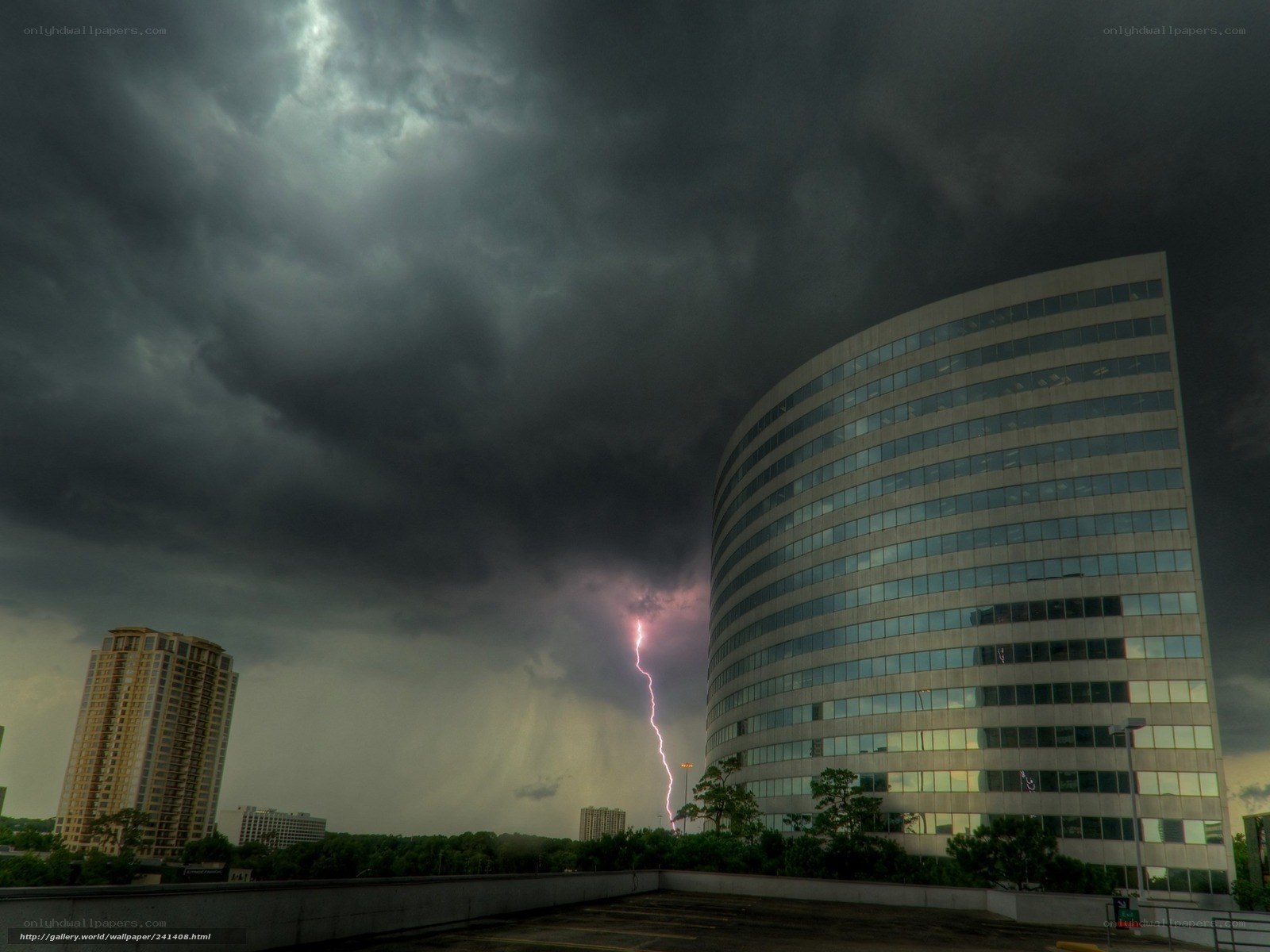Lightning strikes over city buildings