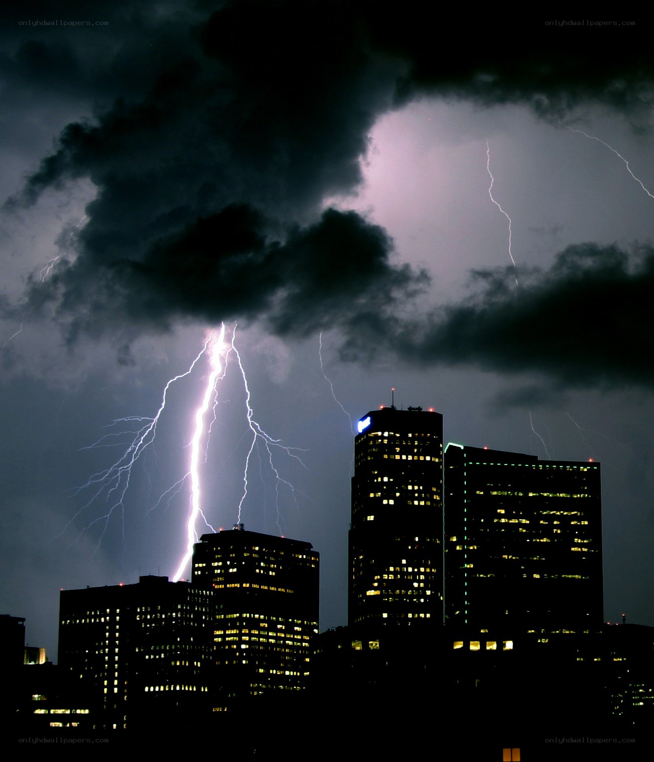 Lightning strikes over city skyline