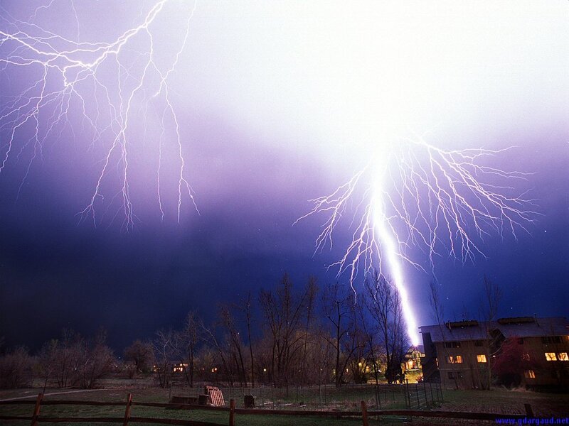 Lightning Strikes over Houses