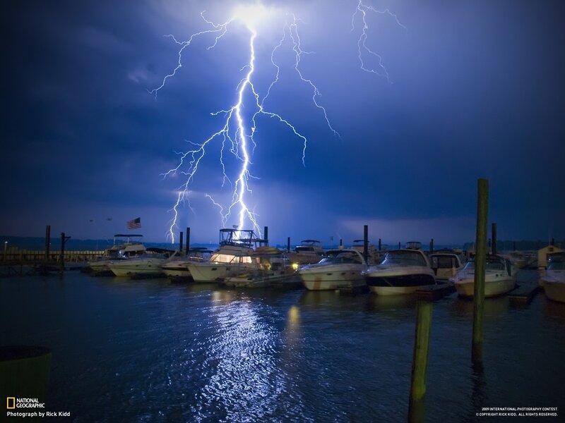 Lightning strikes over marina