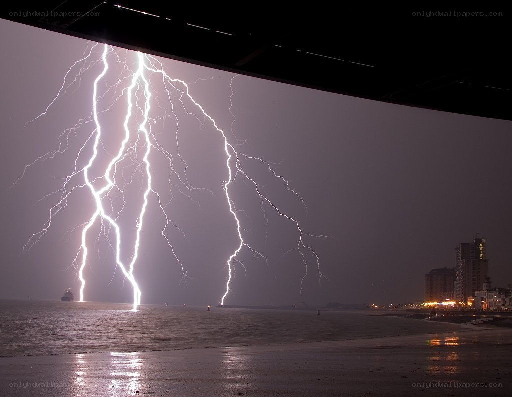Lightning strikes over the sea