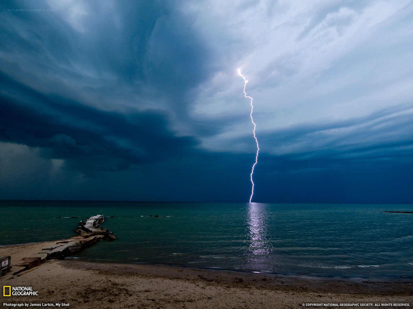Lightning strikes over the sea