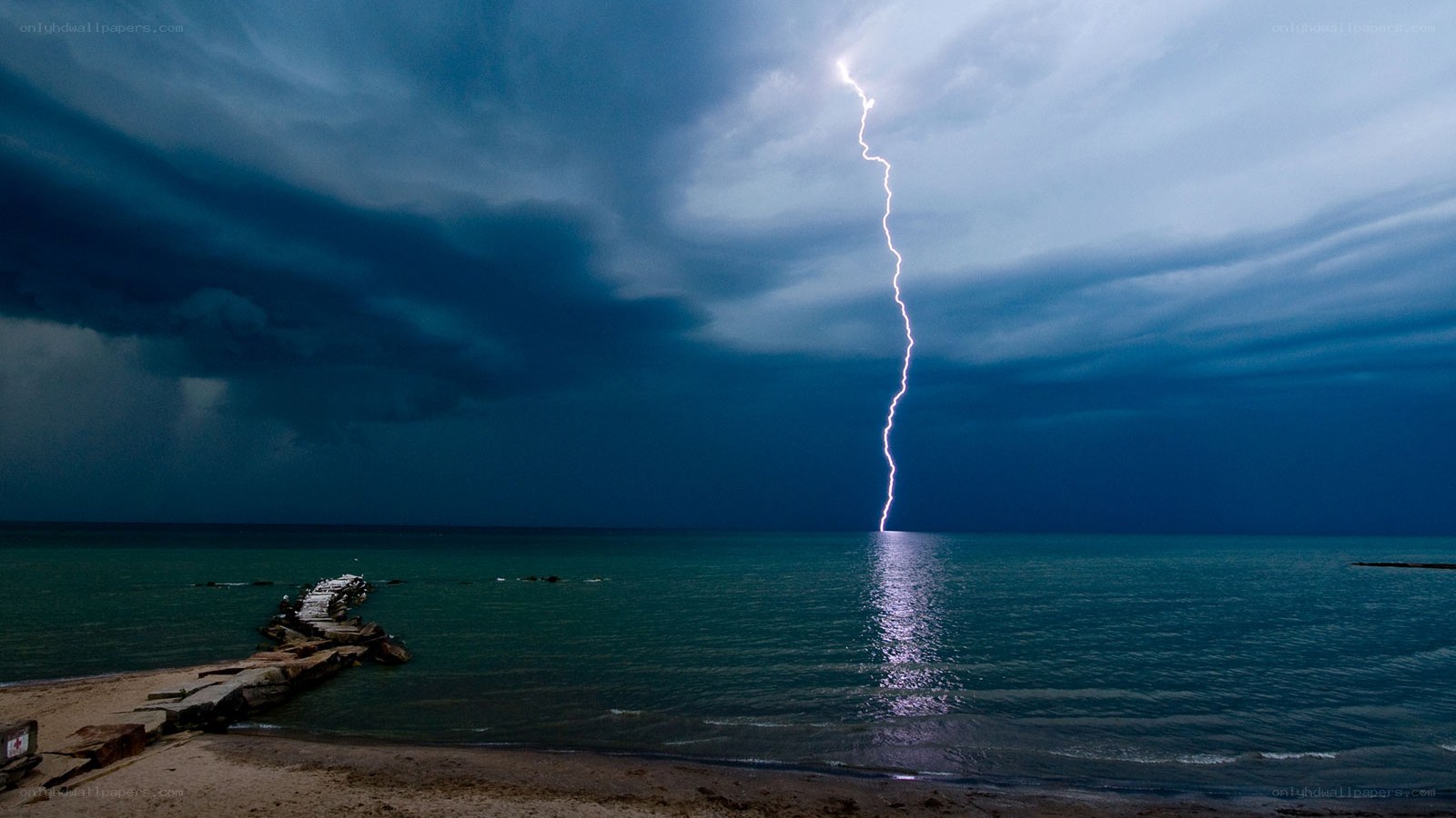 Lightning strikes over the sea