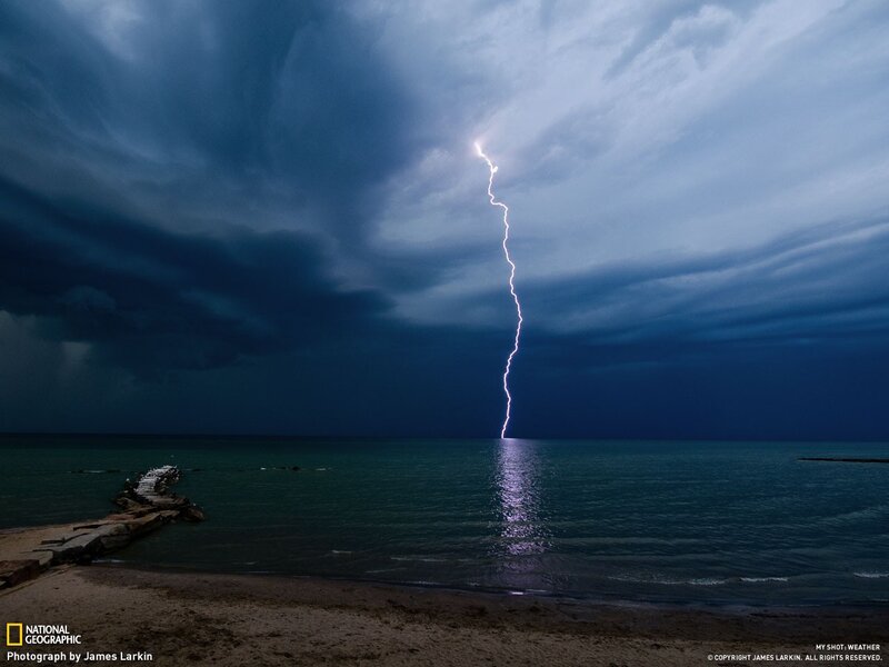Lightning strikes over the sea