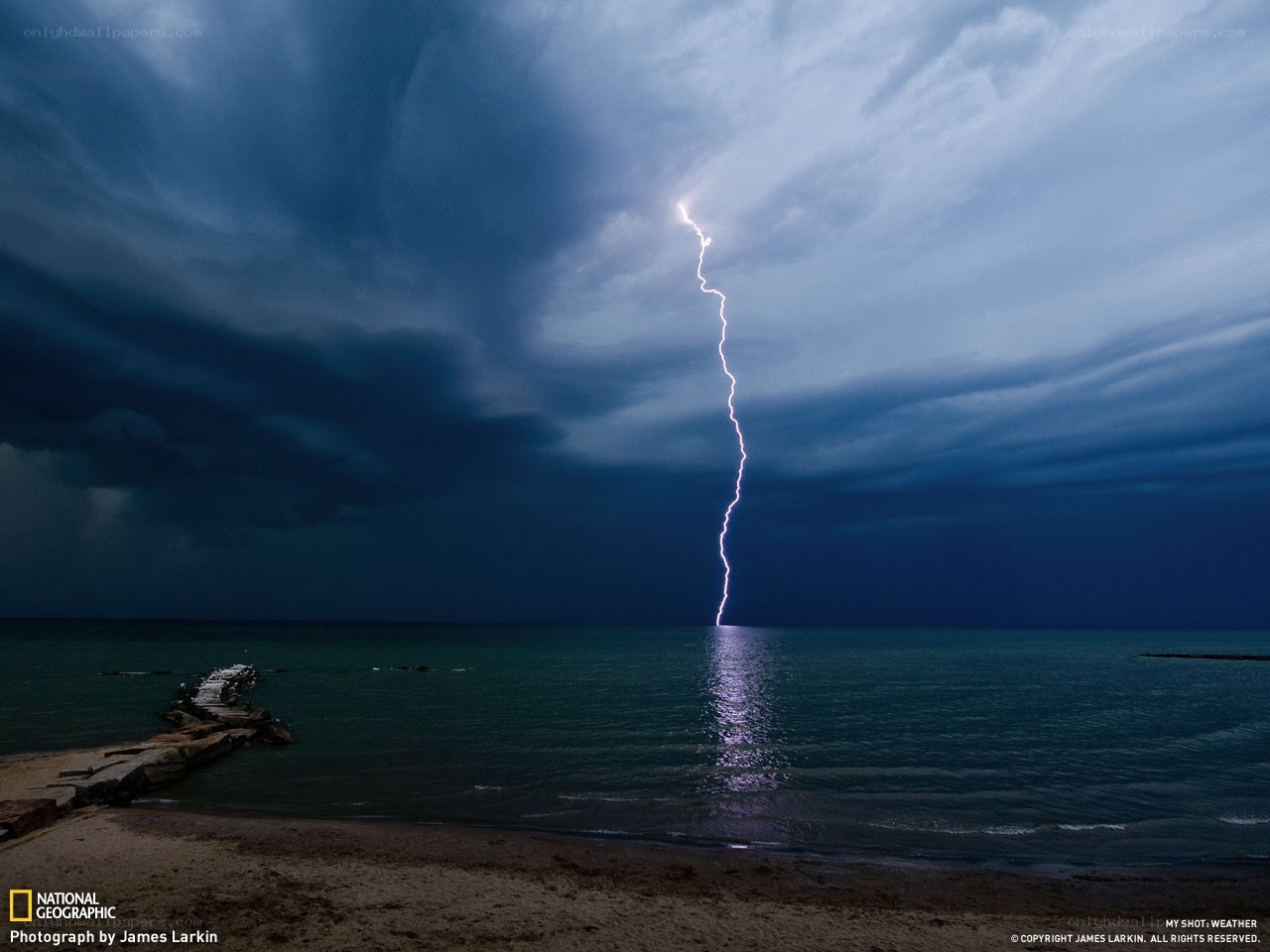 Lightning strikes over the sea