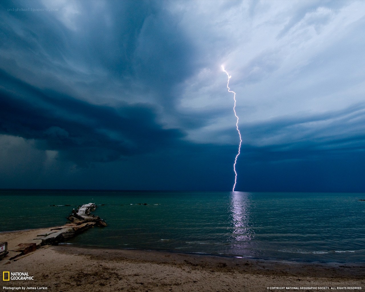 Lightning strikes over the sea