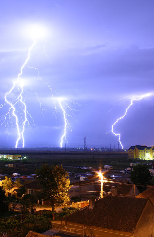 Lightning strikes over town