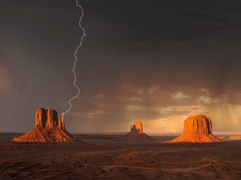 Lightning Striking Rock Formations — Orange, Dramatic