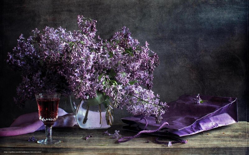 Lilac bouquet with wine glass