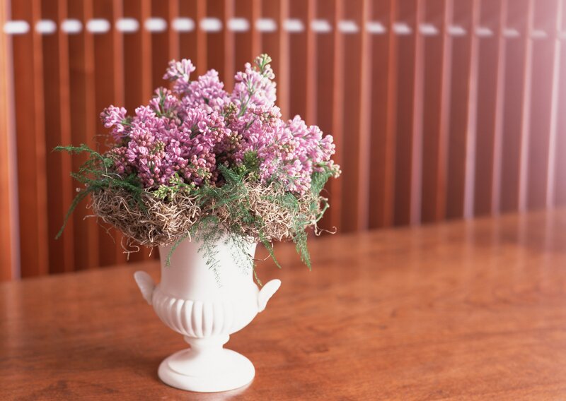 Lilac flowers in a white vase