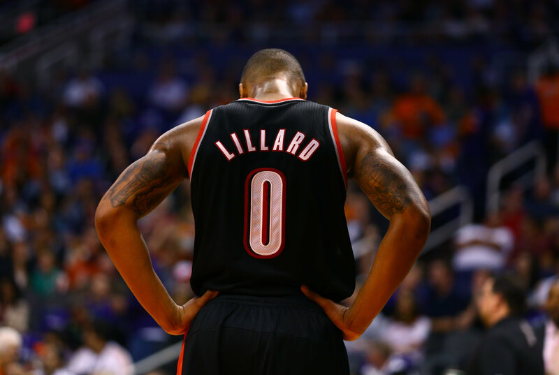 Lillard on court with hands on hips
