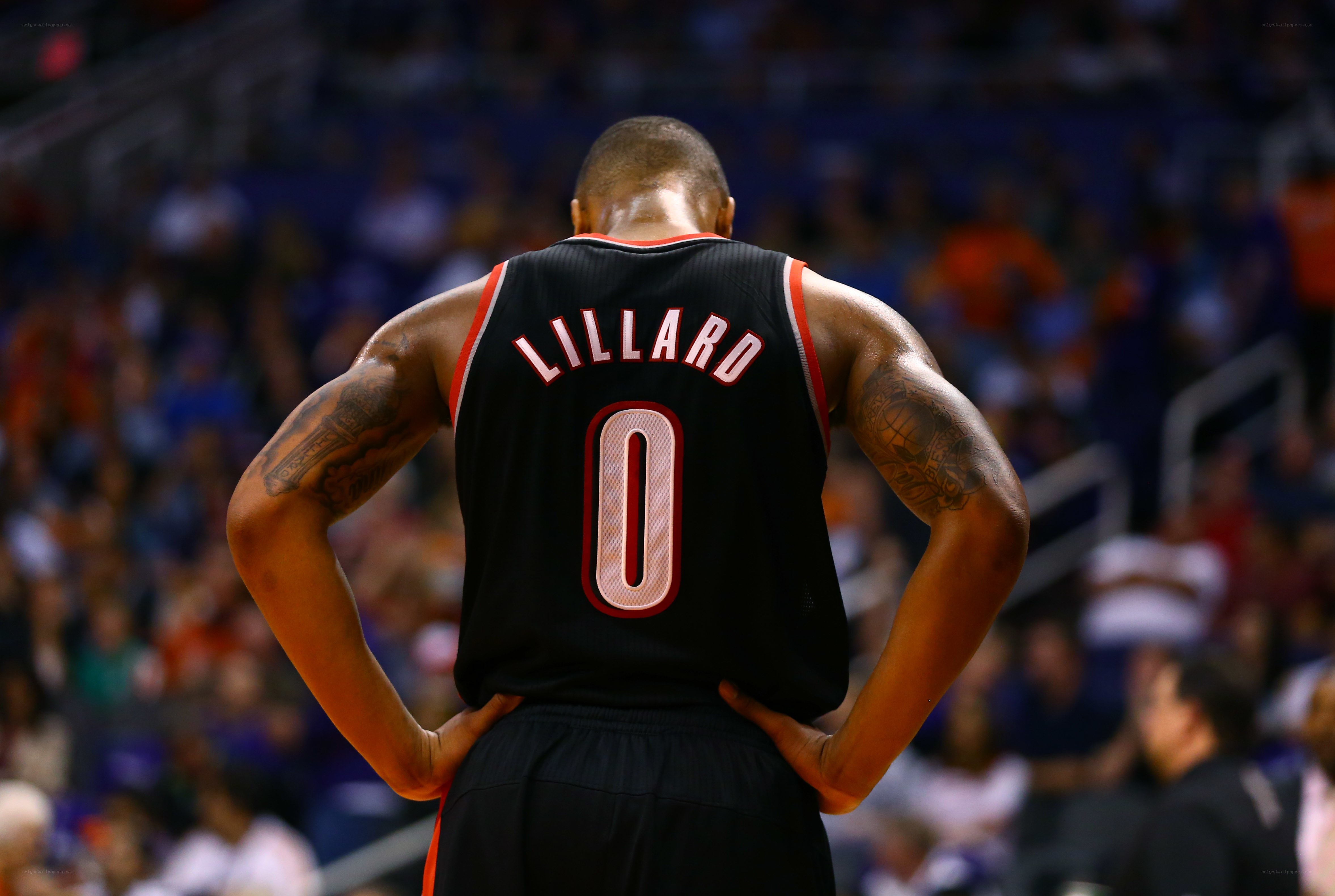 Lillard on court with hands on hips