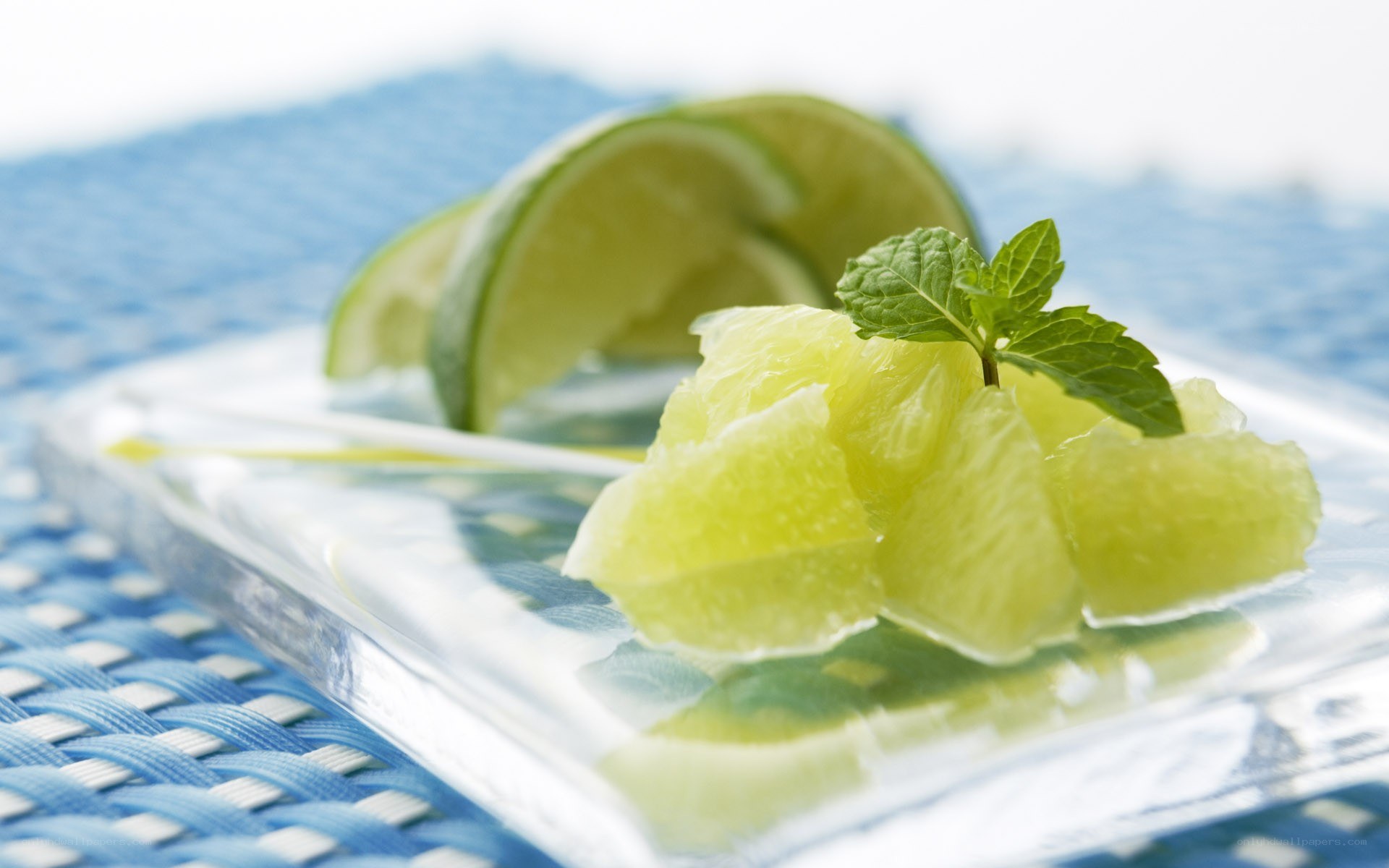 Lime and mint on glass plate