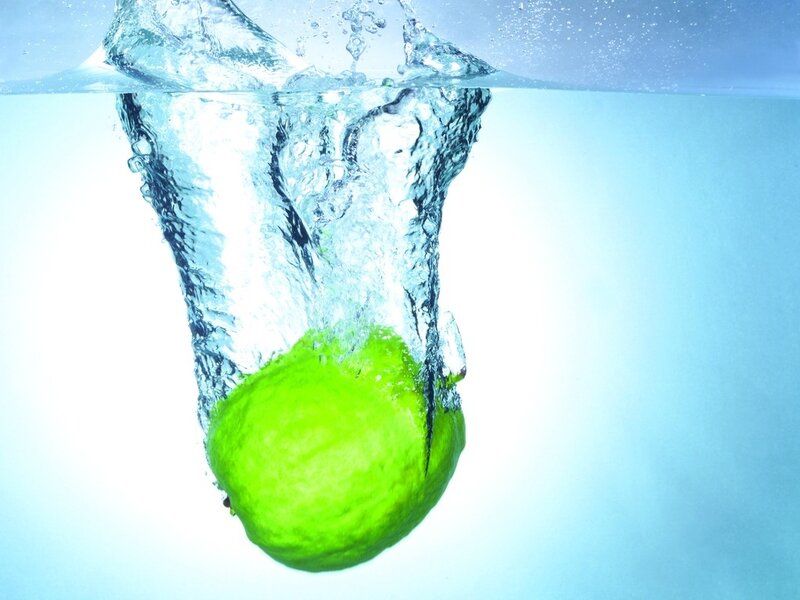 lime dropping into water