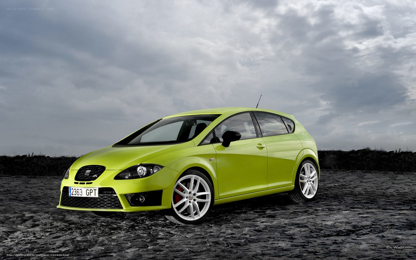 lime green car on cobblestones