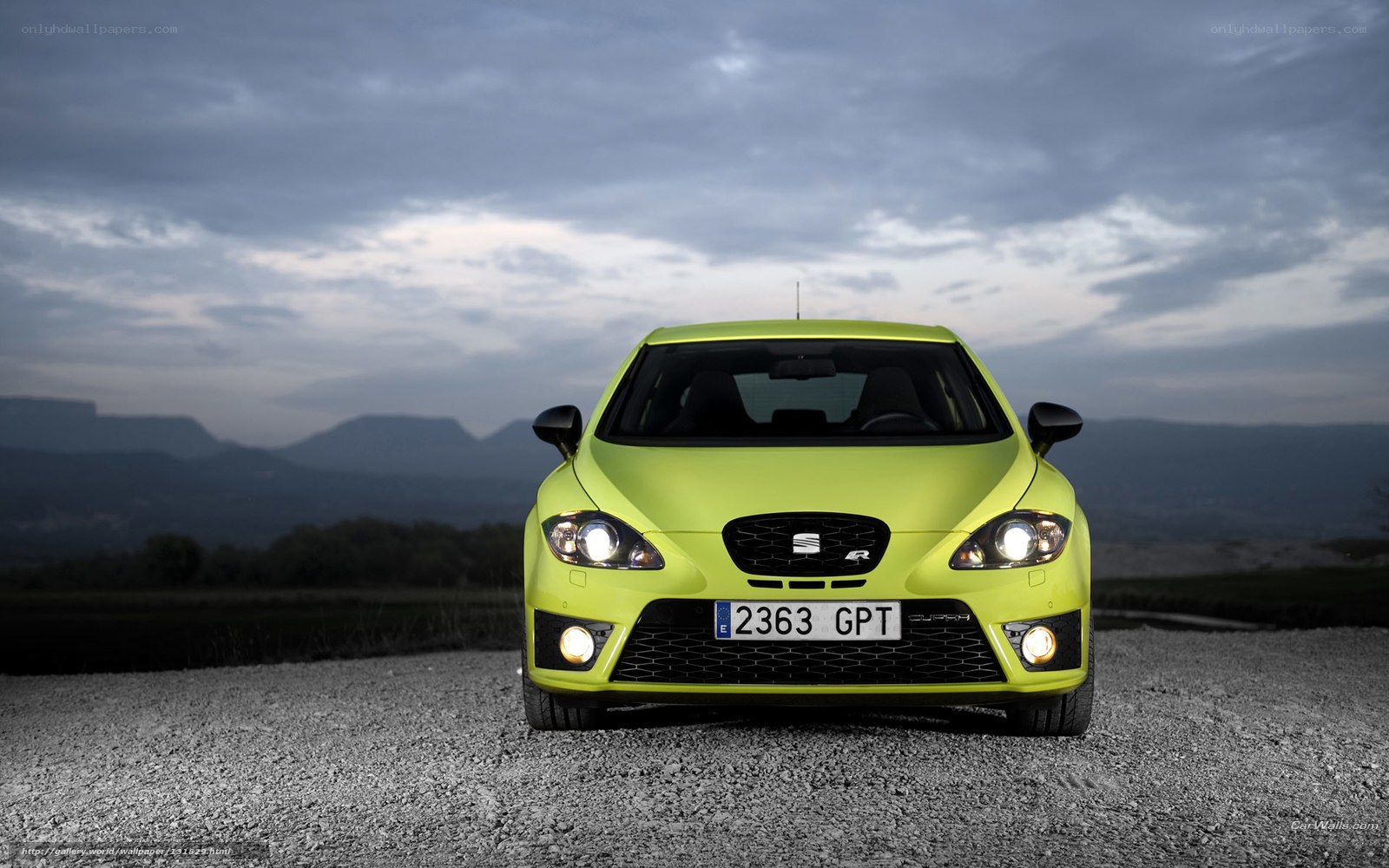 lime green car on gravel