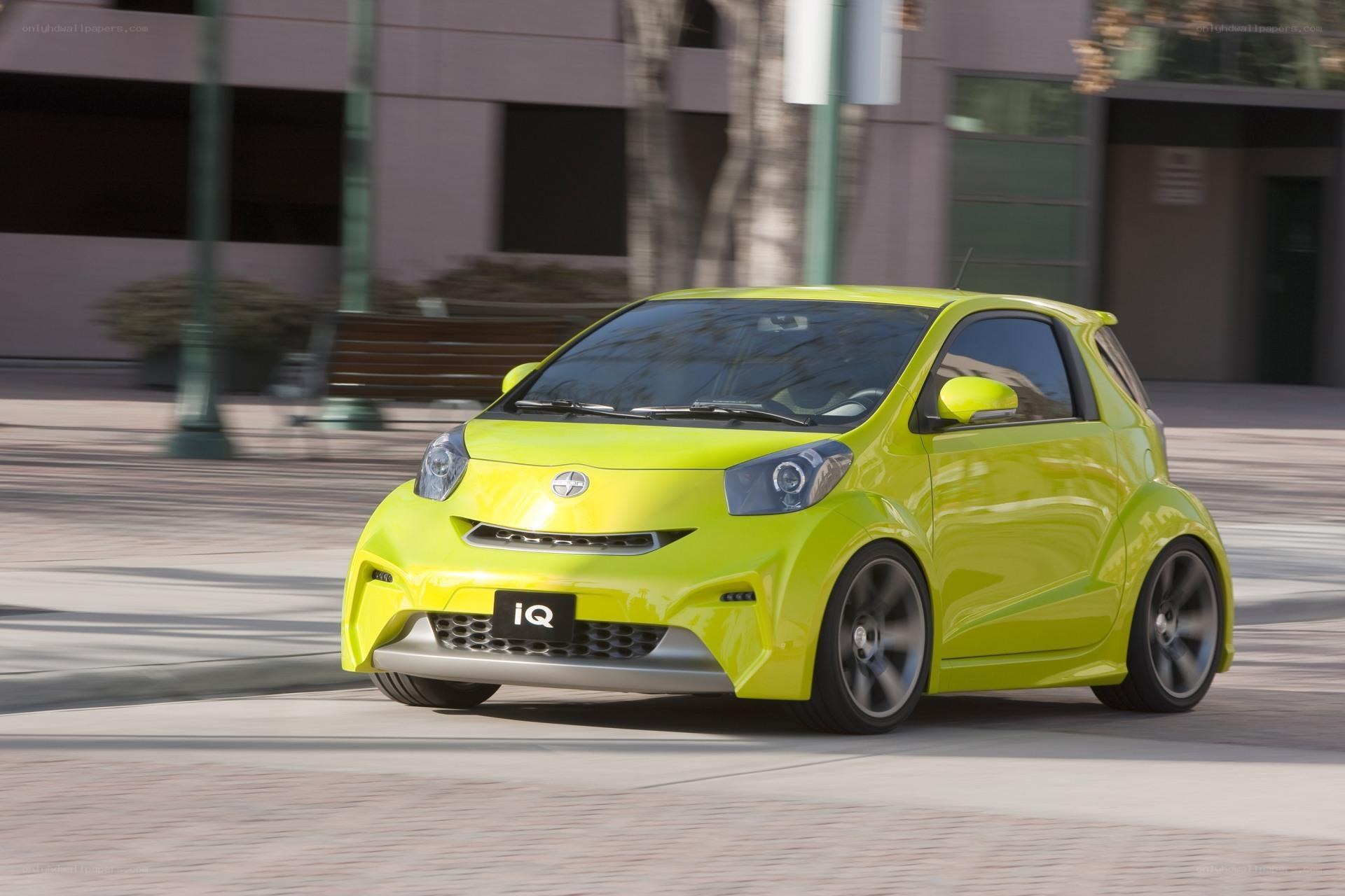 Lime green compact car in motion