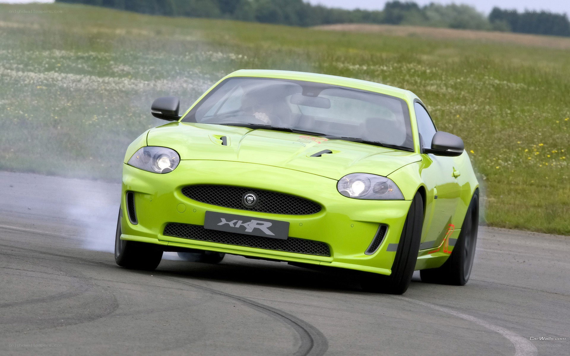 lime green jaguar xkr in motion