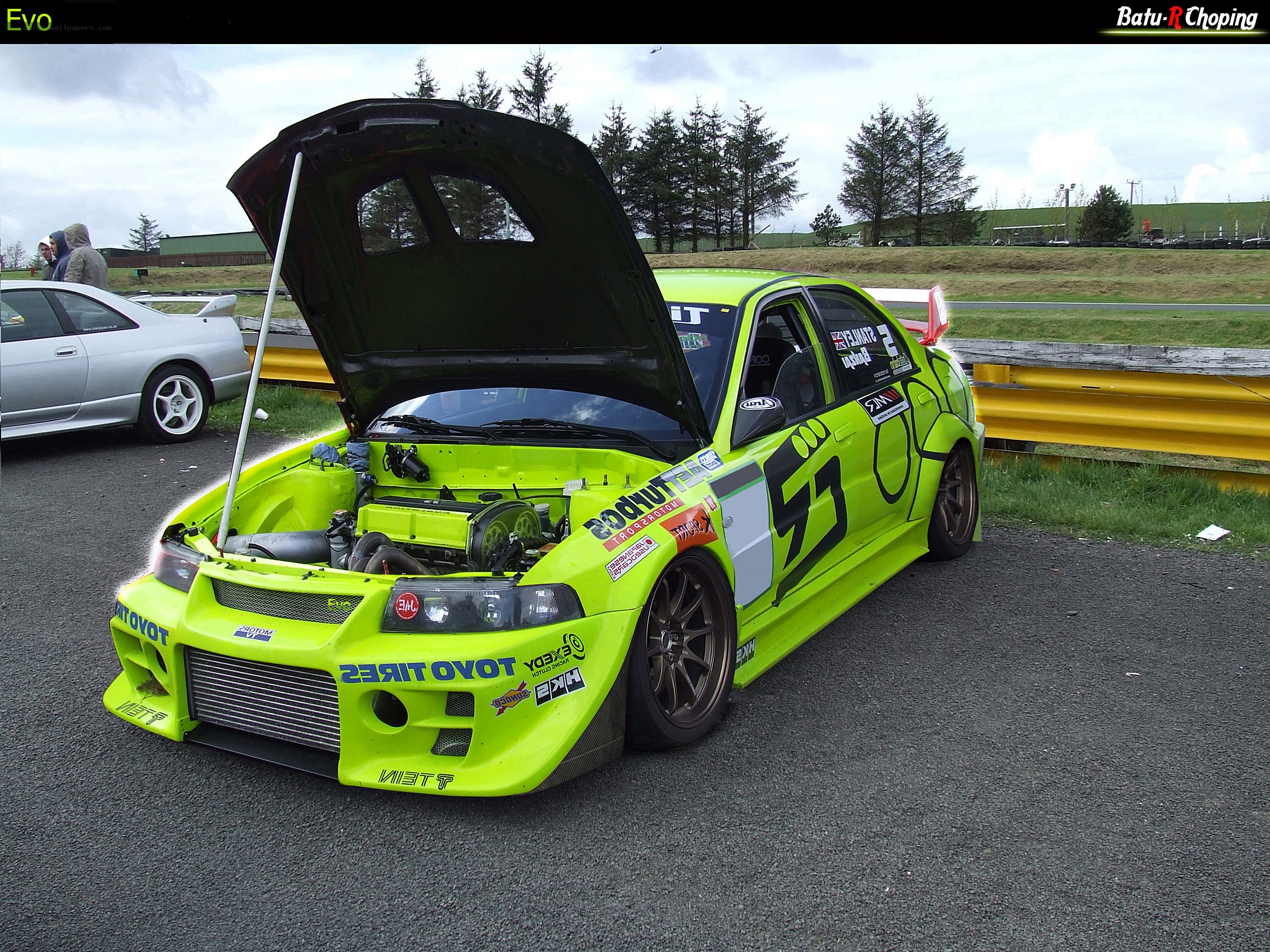 lime green race car with open hood